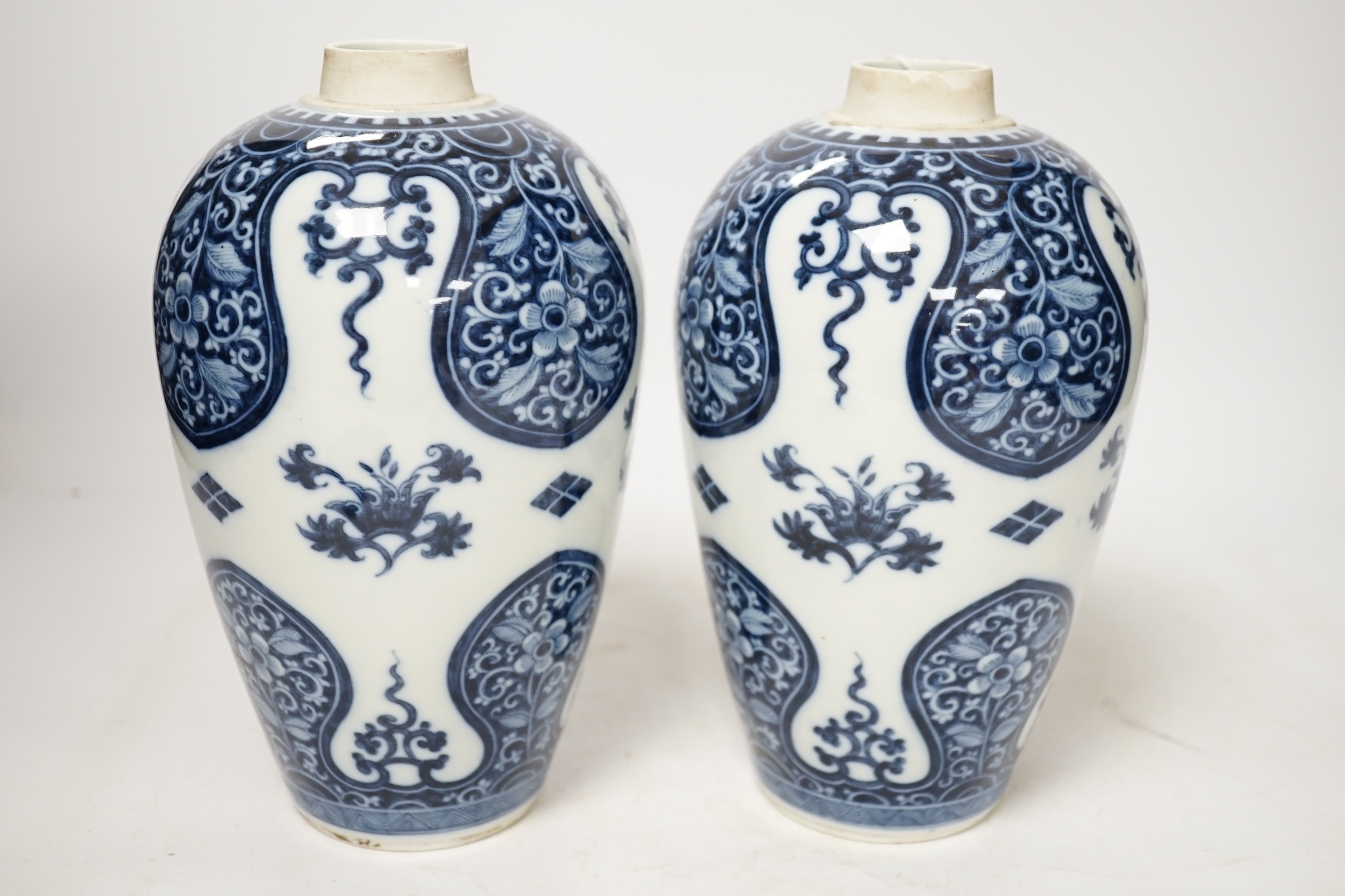 A pair of Samson of Paris blue and white vases, in Kangxi style 23cm high. Condition - good